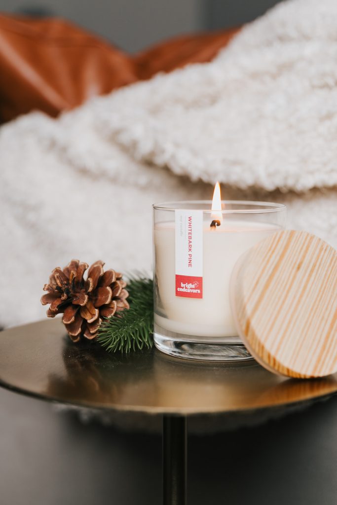 The Whitebark Pine soy candle in the Signature Glass is our best selling holiday scent!