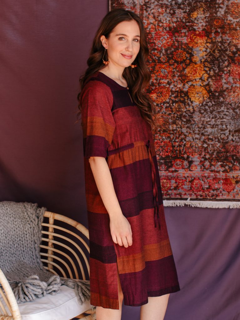 The Nisha dress features a soft blend of cotton/rayon in beautiful jewel-toned colors, a side slit and drawstring waist.