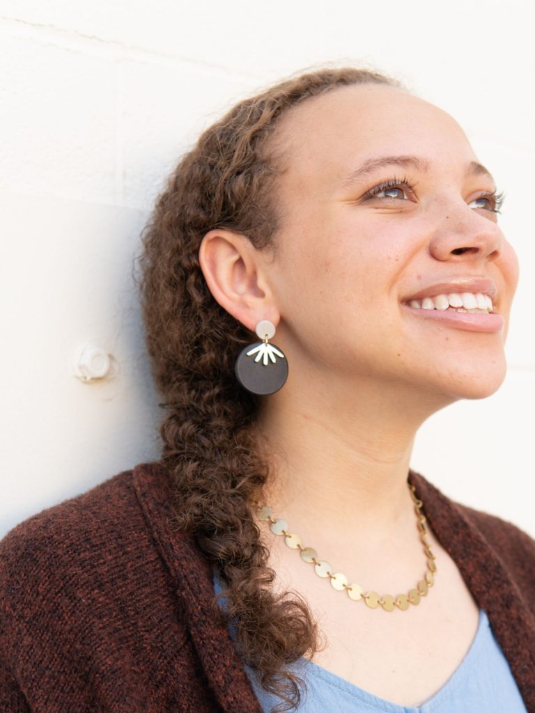 Inspired by Ruth Bader Ginsburg's iconic vibes, these round black and brass clay earrings will subtly channel your inner feminist wherever you are. Earrings measure 1.75". Made from clay and recycled brass-plated metal. Nickel-free.